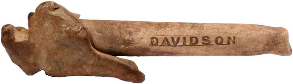 A soldier's clay pipe, with an improvised lead bowl and teeth marks on stem. A soldier's clay pipe, with an improvised lead bowl and teeth marks on stem.