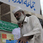 Man donates clothes for Pakistan flood victims Man donates clothes for Pakistan flood victims