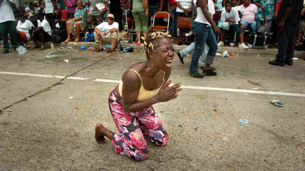 A woman screams outside the Convention Center in New Orleans. A woman screams outside the Convention Center in New Orleans.