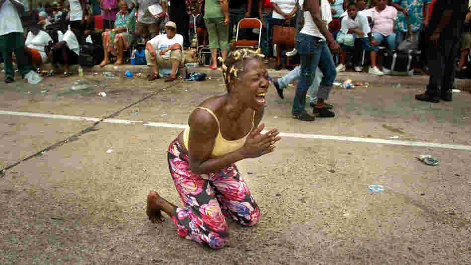 A woman screams outside the Convention Center in New Orleans. A woman screams outside the Convention Center in New Orleans.