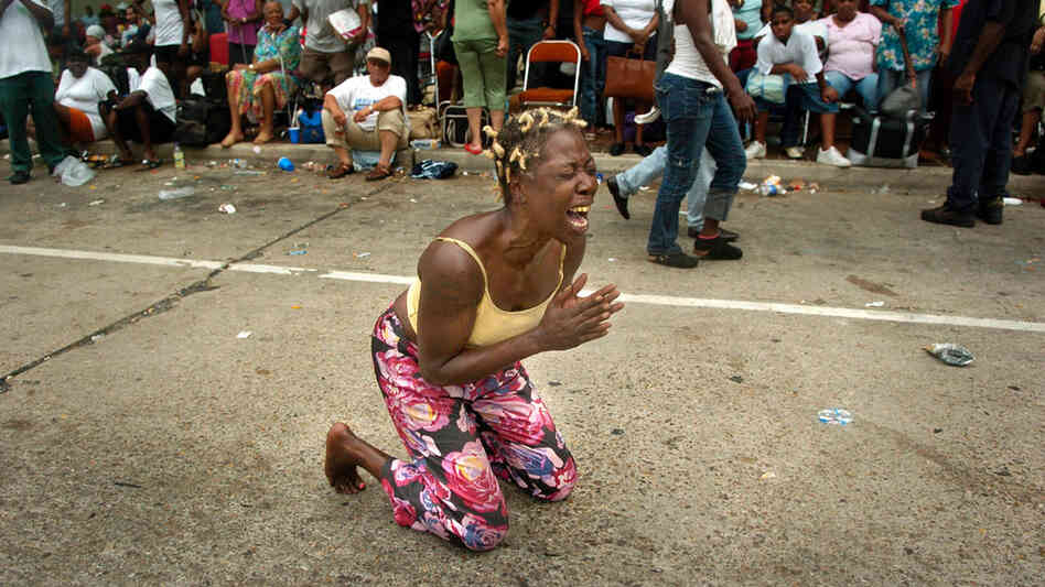 A woman screams outside the Convention Center in New Orleans. A woman screams outside the Convention Center in New Orleans.
