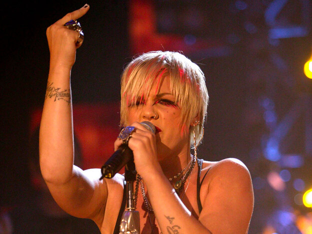 Pink lets her bird fly during a concert in London.