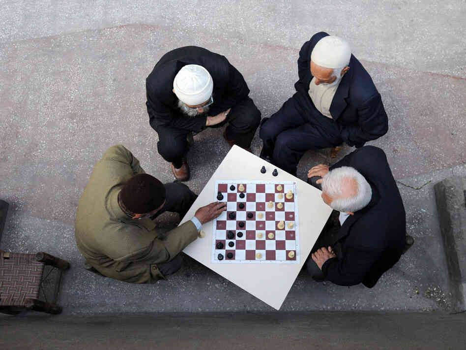 Kurdish men in Turkey play chess.