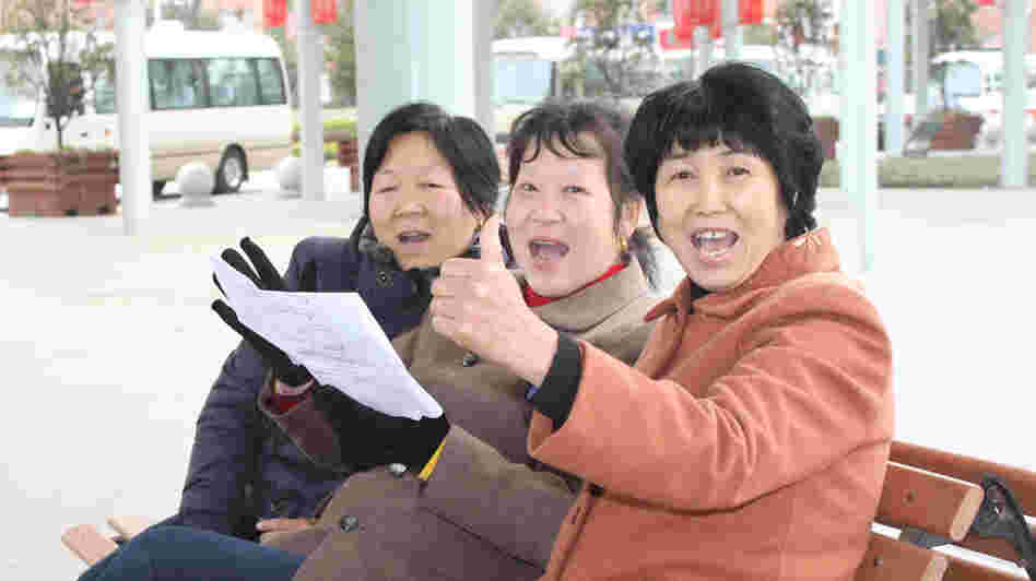 Residents of Jiangyin sing in one of the city's public squares