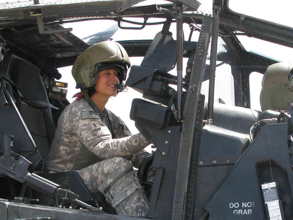 U.S. Army Chief Warrant Officer Stephanie Rose sits in an Apache attack helicopter