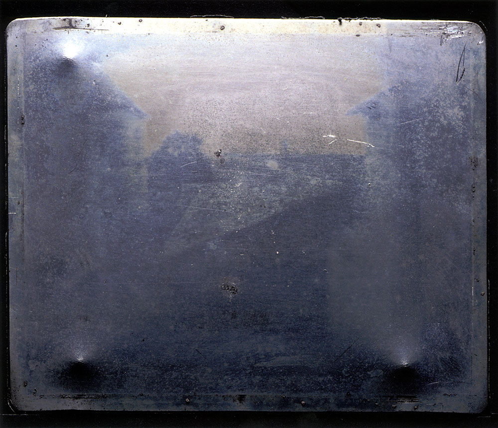 Official image of the "first photograph" -- Joseph Nicephore Niepce's View from the Window at Le Gras, circa 1826 -- in 2003, without manual retouching.