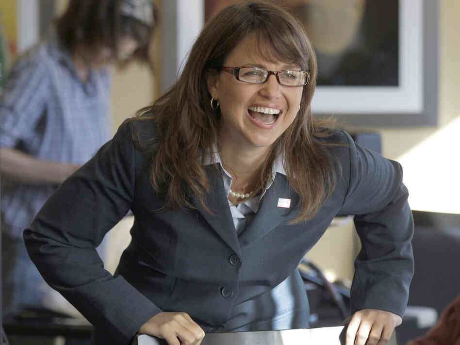 Delaware Republican Senate candidate Christine O'Donnell laughs while talking with family members.