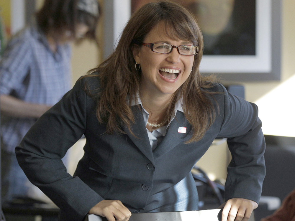 Delaware Republican Senate candidate Christine O'Donnell laughs while talking with family members.