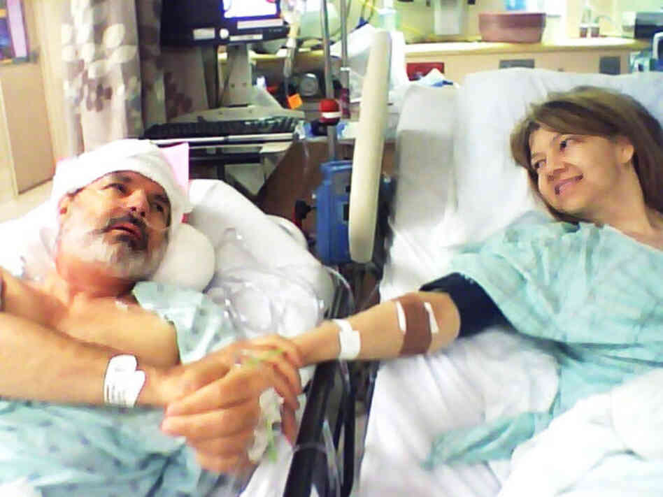 Jeff Moyer and Julie Stinson clasped hands after Moyer donated his kidney to her. Jeff Moyer and Julie Stinson clasped hands after Moyer donated his kidney to her.