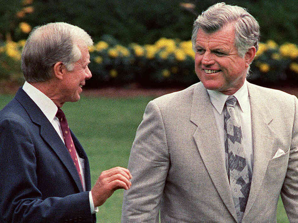 Former President Jimmy Carter, left, with his political rival Sen. Edward Kennedy in 1988.