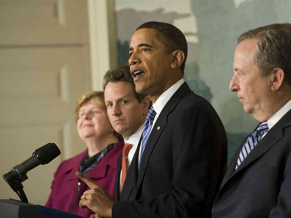 President Obama at the White House surrounded by some of his economic advisers.