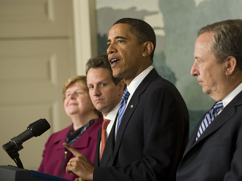 President Obama at the White House surrounded by some of his economic advisers.