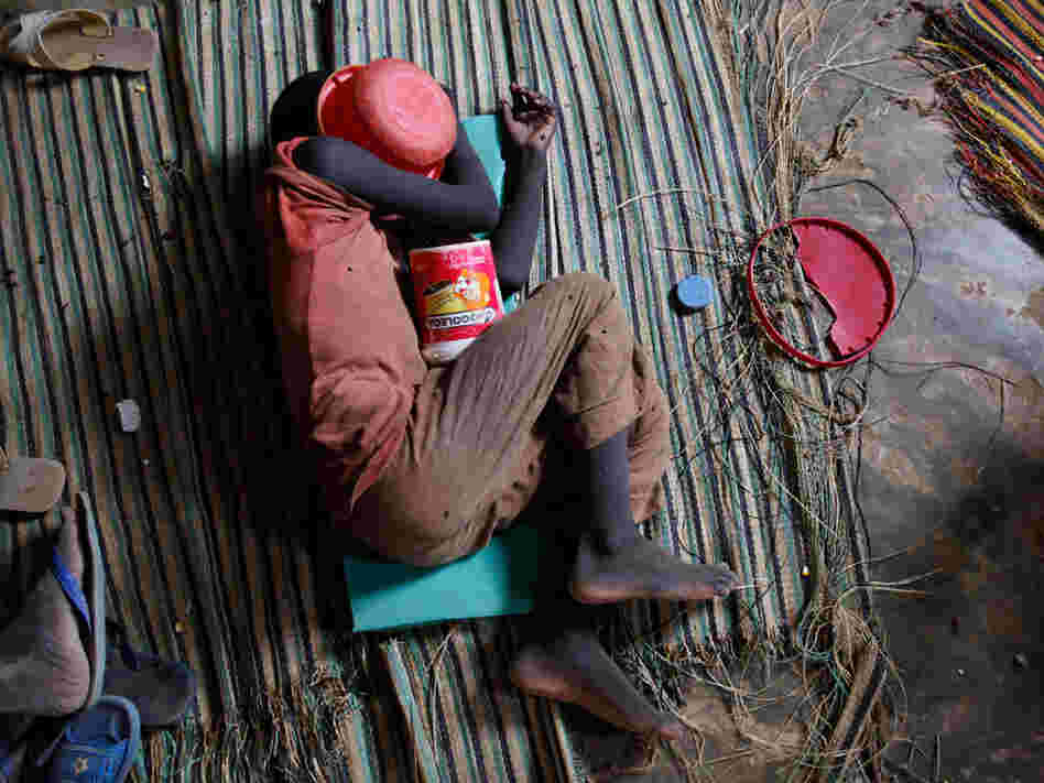 Quranic student sleeps with begging bowl over his head