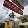 A pre-foreclosure sign in front of a Miami home A pre-foreclosure sign in front of a Miami home