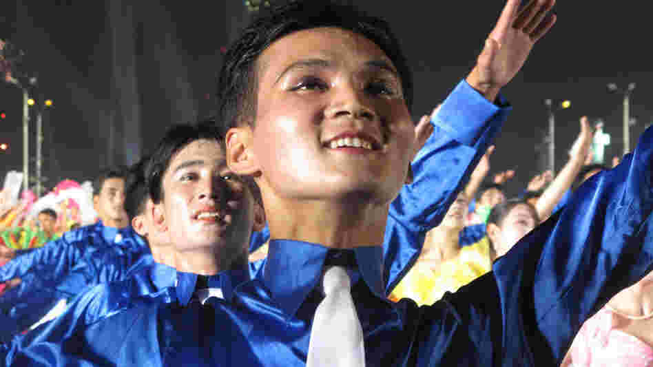 North Koreans attend a political rally in Pyongyang