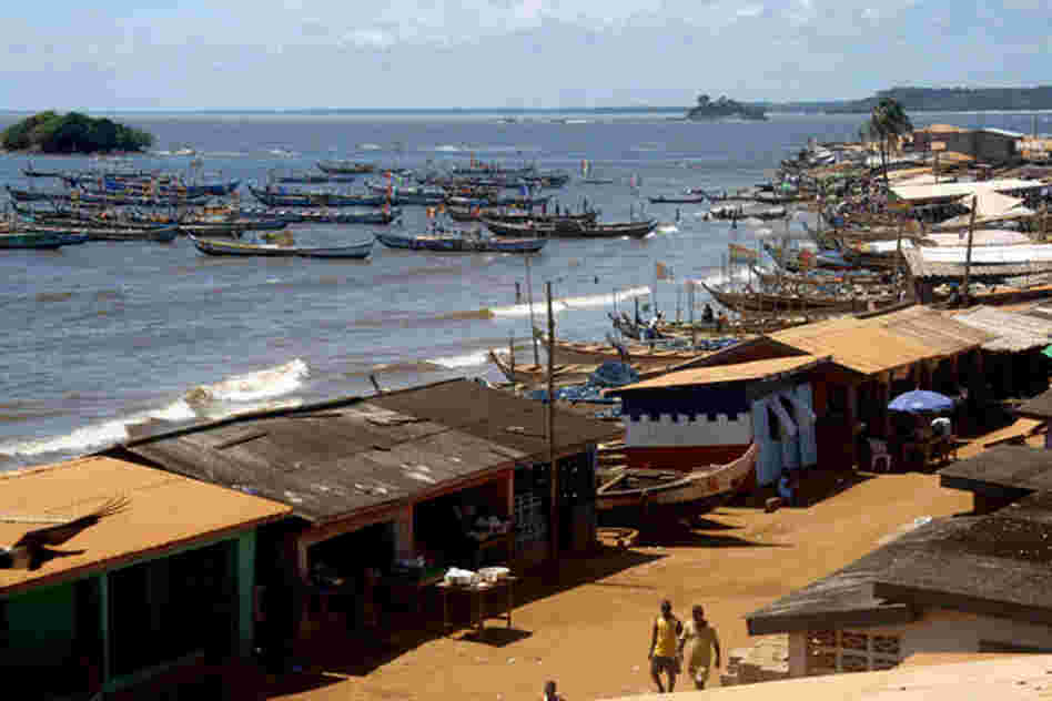 Dugout wooden fishing canoes bobbing on the Atlantic Ocean, beneath the village of Apewosika in central Ghana. Dugout wooden fishing canoes bobbing on the Atlantic Ocean, beneath the village of Apewosika in central Ghana.