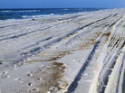 Waves breaking on the shore in Orange Beach, Ala., leave behind an oily residue. Waves breaking on the shore in Orange Beach, Ala., leave behind an oily residue.