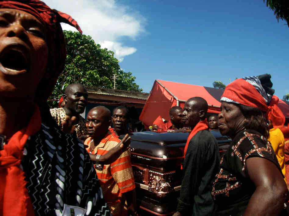 villagers from the Otuam fishing community carry the casket of their late ruler Nana Amuah-Afenyi.