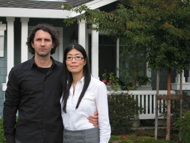 Grace Chen and her husband, Antonis Orphanou, stand outside their home in Mountain View, Calif.
