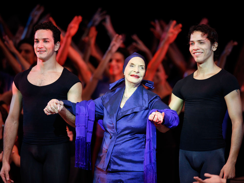 Alicia Alonso, Cuba's prima ballerina and director of Cuba's National Ballet (center) is escorted by dancers during the opening ceremony last month of the 22nd International Ballet Festival in Havana, Cuba.