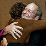 Bishop V. Gene Robinson, right, hugs a friend after announcing his retirement on Saturday. Bishop V. Gene Robinson, right, hugs a friend after announcing his retirement on Saturday.