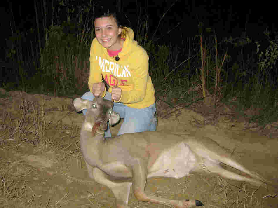 Magan Hebert, 15, poses with the young buck, or "spike" that she shot in Wayneboro, Miss.