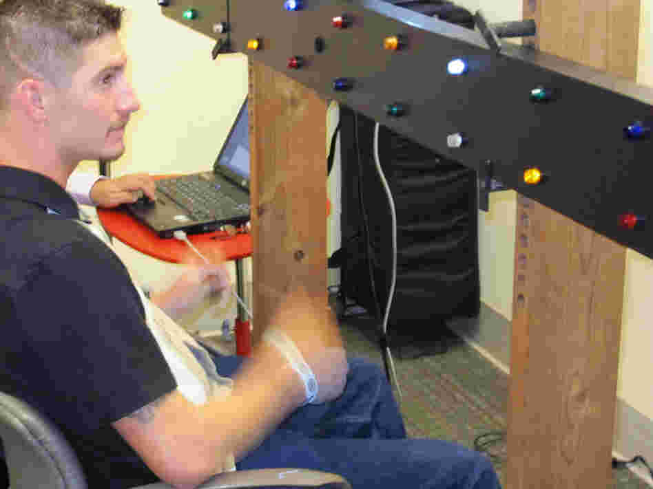 Iraq vet Chris Rader takes an advanced vision test designed to spot hemianopsias and other vision problems. 