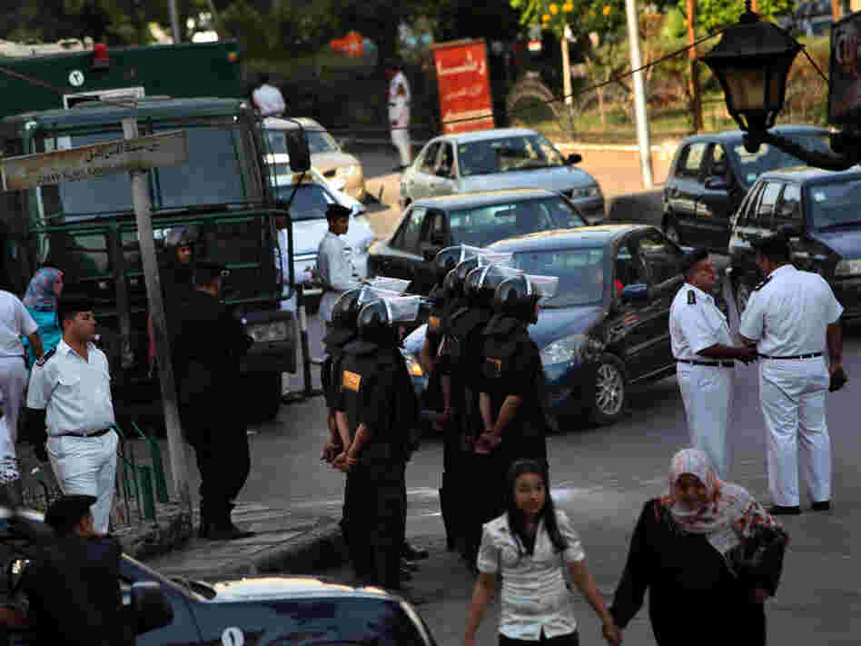 Riot police stand guard in anticipation of a petition drive by Mohamed ElBaradei's political party