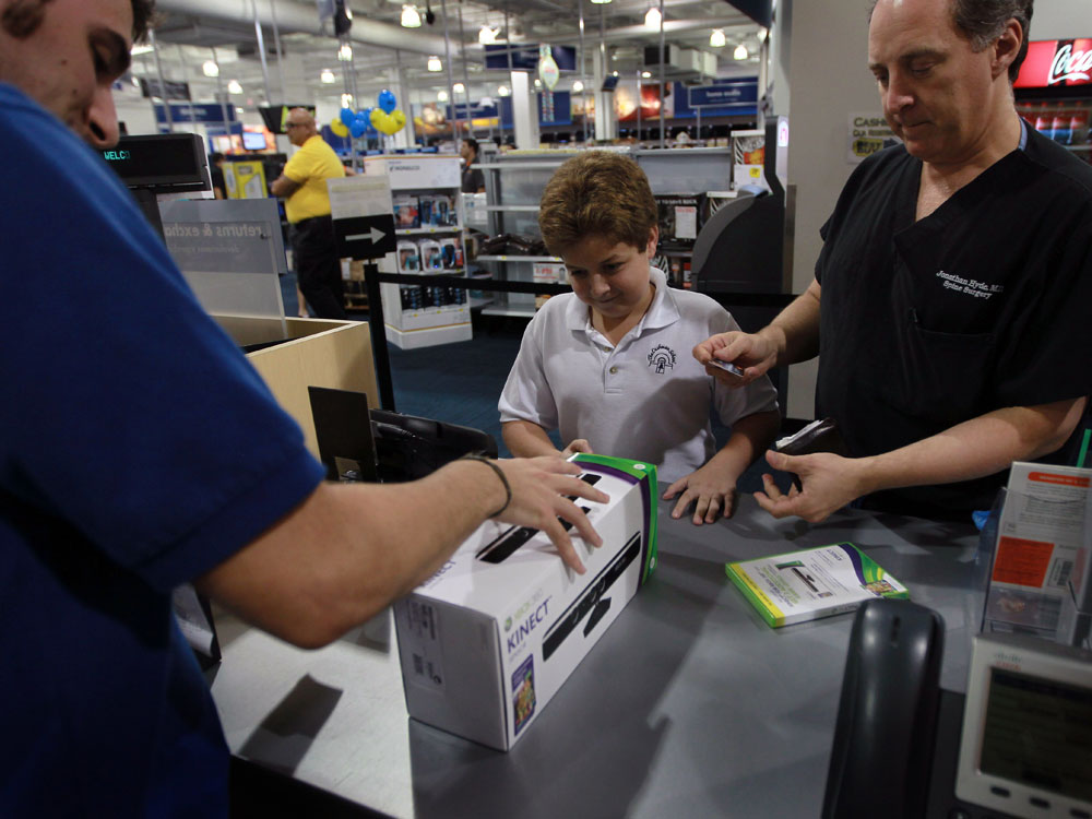 Peter Martin sells Microsoft's new Kinect controller at a Best Buy.
