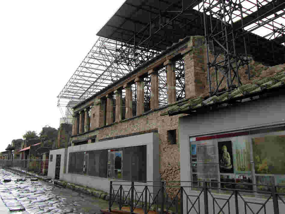 Steel scaffolding and the roof weigh on the original 2,000-year-old walls in Pompeii, Italy.