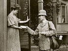A mail carrier delivers a letter to a customer in Milwaukee, Wis., circa 1908. A mail carrier delivers a letter to a customer in Milwaukee, Wis., circa 1908.