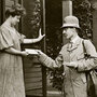 A mail carrier delivers a letter to a customer in Milwaukee, Wis., circa 1908.
