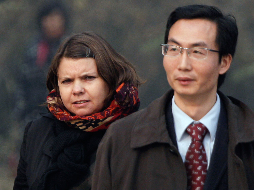 Canadian Karen Patterson (left), wife of Chinese artist Wu Yuren, walks with her lawyer Li Fangping
