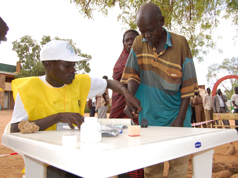 Poll worker helps prospective voter register for next month's referendum on independence for Southern Sudan Poll worker helps prospective voter register for next month's referendum on independence for Southern Sudan