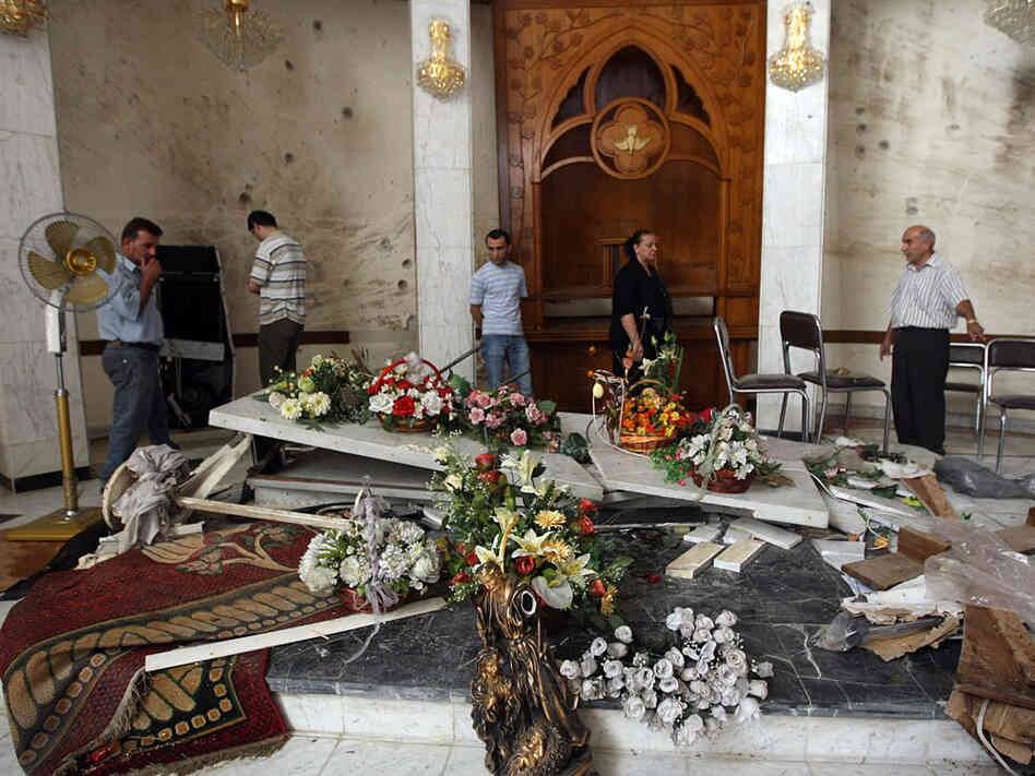 Iraqi Christians inspect damage at Our Lady of Salvation Church 