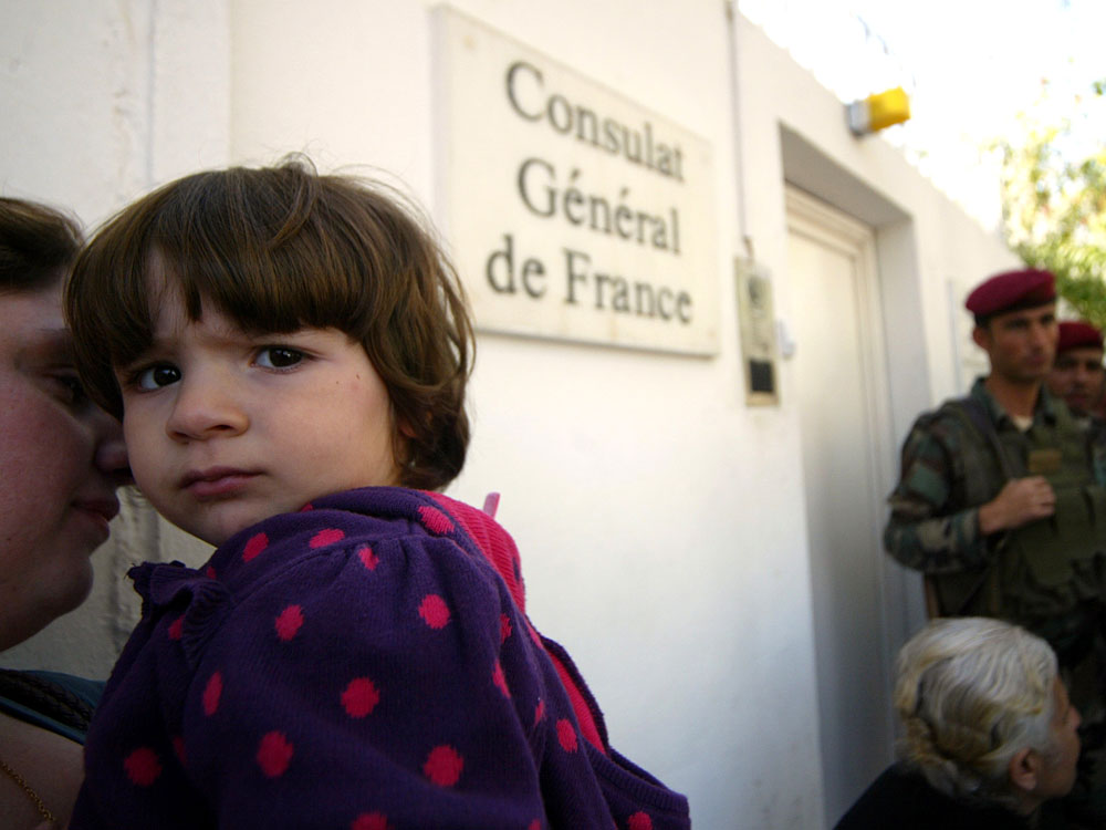 Iraqi Christians hoping to emigrate to France wait outside French Consulate in Irbil Iraqi Christians hoping to emigrate to France wait outside French Consulate in Irbil