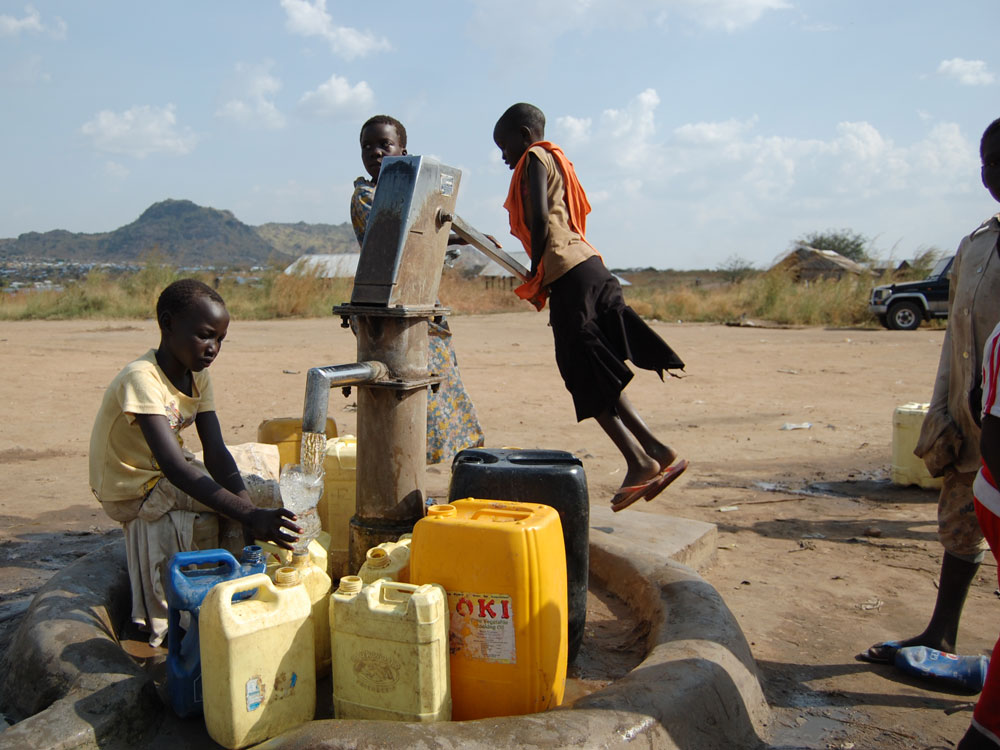 Many residents of Gudele West must walk more than half a mile to get water Many residents of Gudele West must walk more than half a mile to get water