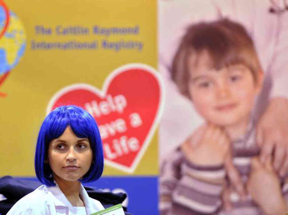 Natasha Smahlei, a model, works at the Caitlin Raymond International Registry exhibit in October.