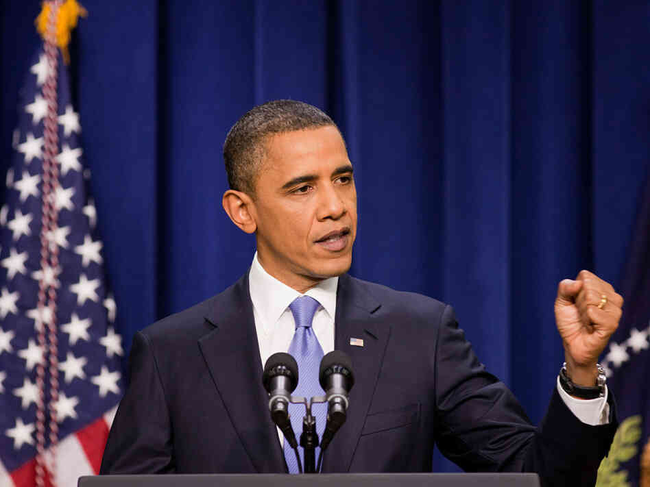 President Obama clenches a fist while making a point at his news conference Wednesday