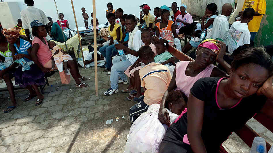 People suffering from dehydration wait to be treated at St. Nicholas Hospital in Saint-Marc, north of Port-au-Prince. People suffering from dehydration wait to be treated at St. Nicholas Hospital in Saint-Marc, north of Port-au-Prince.