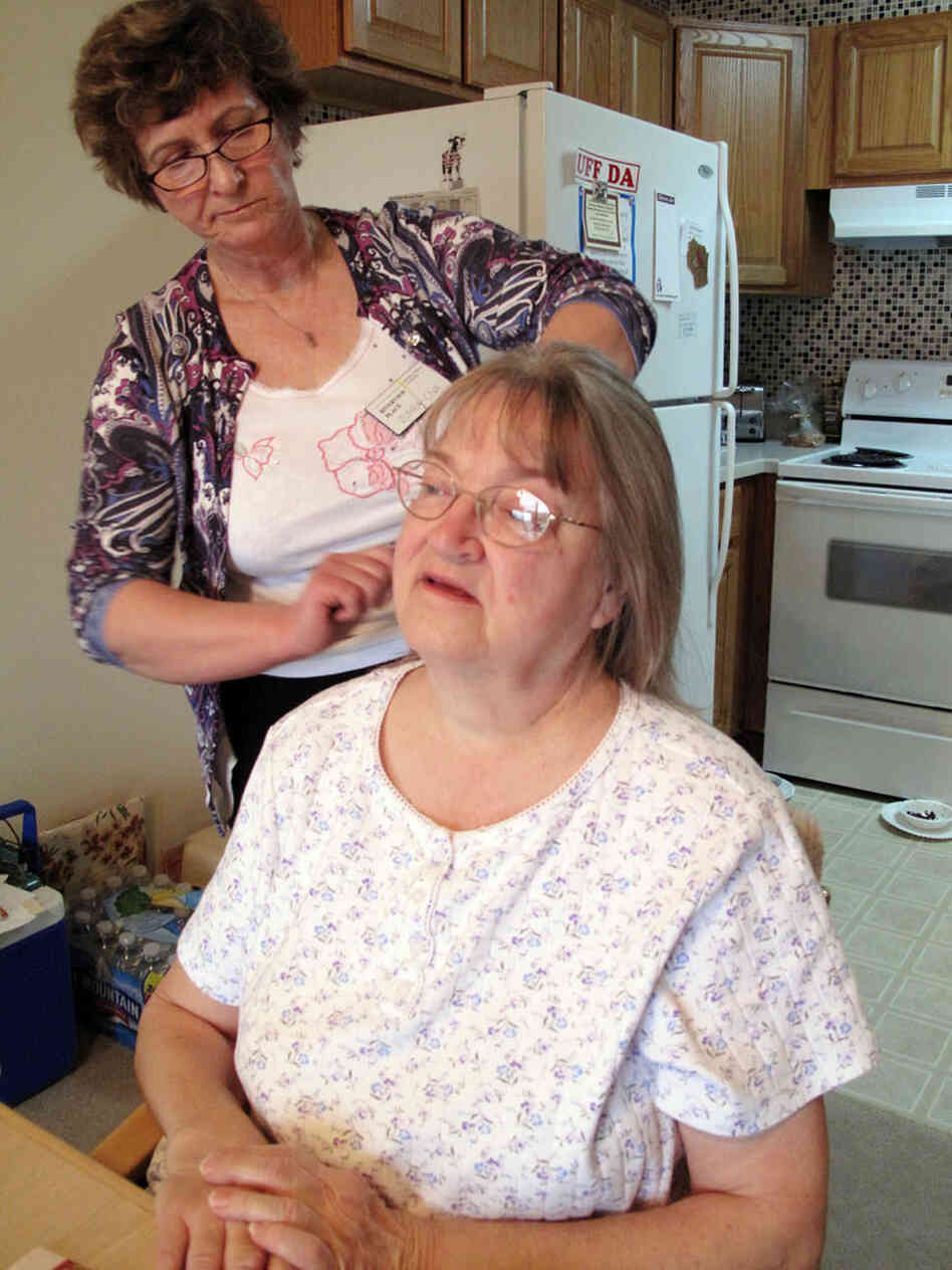Certified Nursing Assistant Zuhra Vukomanovic tends to Riverview Place resident Vera Twidwell. Certified Nursing Assistant Zuhra Vukomanovic tends to Riverview Place resident Vera Twidwell.