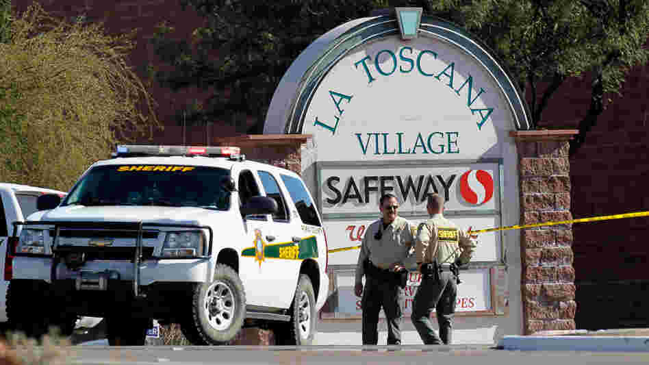 Law enforcement officials were still trying to piece together a chronology of events and a possible motive for Saturday's shooting rampage at a Safeway in Tucson, Ariz.