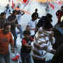 Bahraini protesters run for cover from tear gas fired by police in the village of Sanabis near the capital city, Manama, on Tuesday.