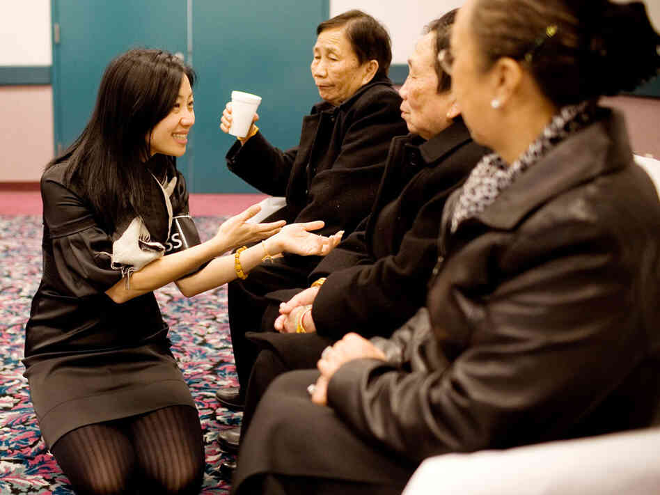 NPR reporter Doualy Xaykaothao speaks with her great-aunts — Gen. Vang Pao's sisters — in Fresno, Calif.