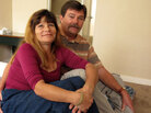 Philip Doud and his girlfriend, Cathy Espong, sit in their new one-bedroom apartment. They both lost their jobs and were found living on a San Diego sidewalk during a survey of the city's homeless population last fall. The Department of Veterans Affairs helped move the couple into permanent housing as part of a campaign to end homelessness. Philip Doud and his girlfriend, Cathy Espong, sit in their new one-bedroom apartment. They both lost their jobs and were found living on a San Diego sidewalk during a survey of the city's homeless population last fall. The Department of Veterans Affairs helped move the couple into permanent housing as part of a campaign to end homelessness.