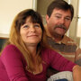Philip Doud and his girlfriend, Cathy Espong, sit in their new one-bedroom apartment. They both lost their jobs and were found living on a San Diego sidewalk during a survey of the city's homeless population last fall. The Department of Veterans Affairs helped move the couple into permanent housing as part of a campaign to end homelessness. Philip Doud and his girlfriend, Cathy Espong, sit in their new one-bedroom apartment. They both lost their jobs and were found living on a San Diego sidewalk during a survey of the city's homeless population last fall. The Department of Veterans Affairs helped move the couple into permanent housing as part of a campaign to end homelessness.