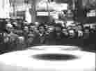 A screen grab from archival film shows a "magnetic egg cooker"