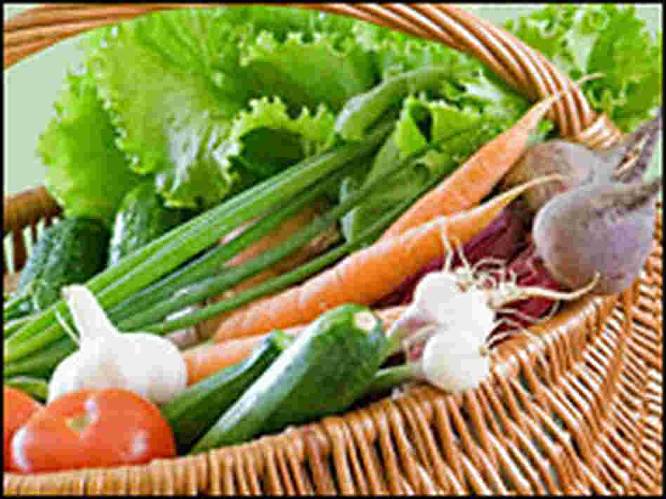 Tomatoes, carrots and peppers in a basket. Tomatoes, carrots and peppers in a basket.