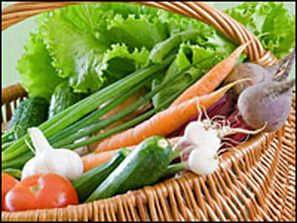Tomatoes, carrots and peppers in a basket. Tomatoes, carrots and peppers in a basket.