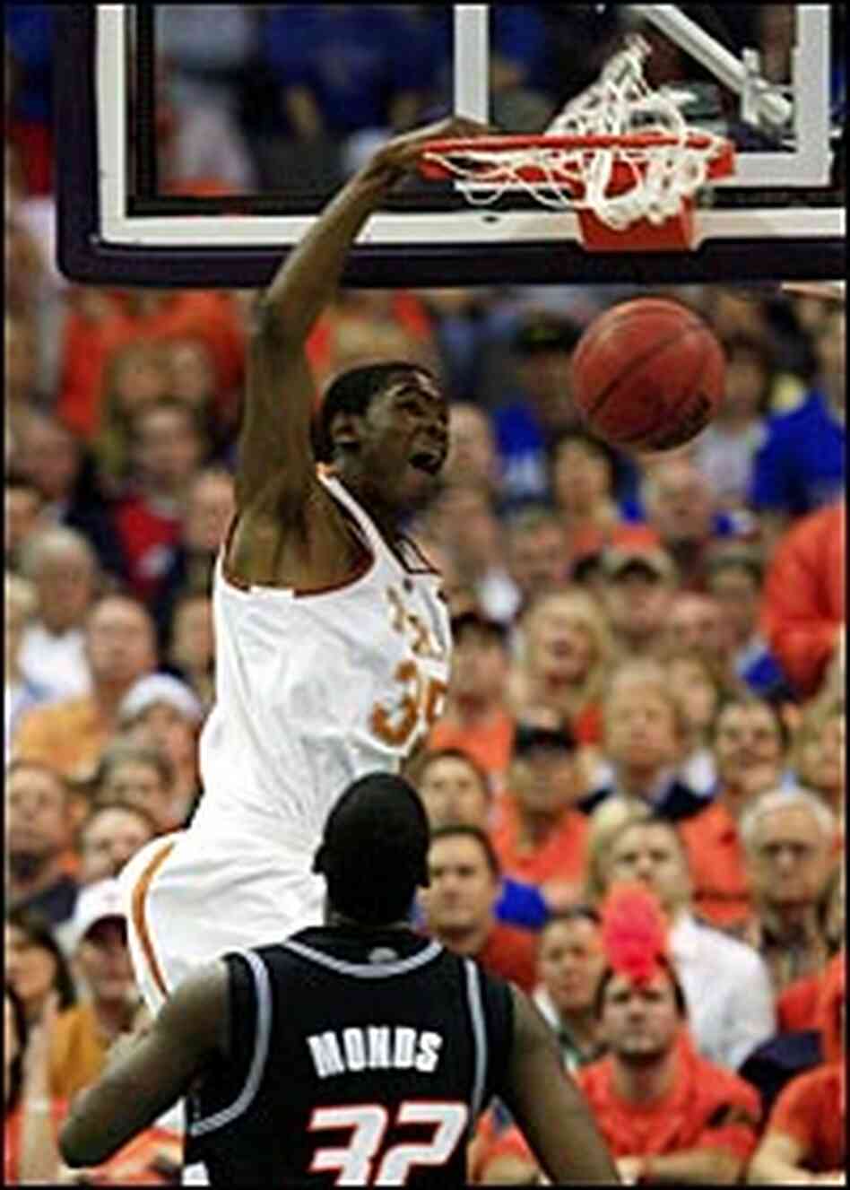 Freshman Kevin Durant of Texas dunks against Oklahoma State. Freshman Kevin Durant of Texas dunks against Oklahoma State.